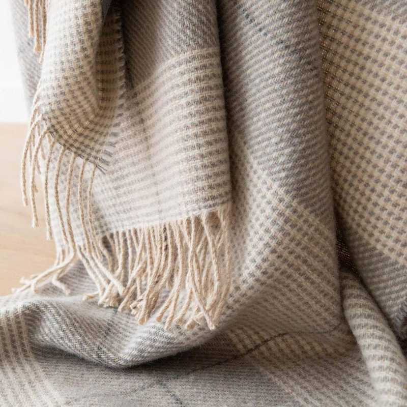 Grey wool throw illustrating warm resilient wool fibres