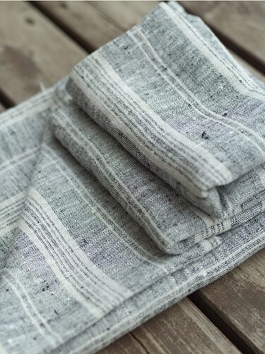 Striped linen guest towels folded for a bathroom