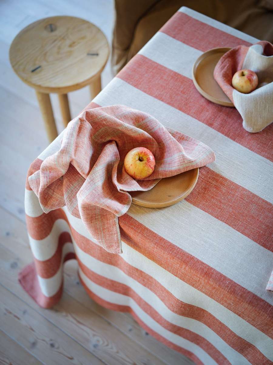 Striped linen napkins with apples on a Venice Brick tablecloth