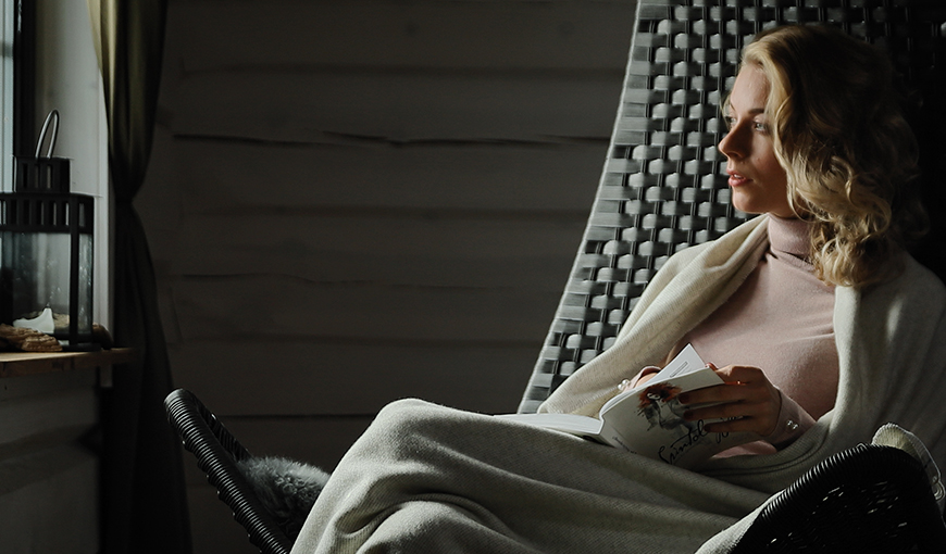 cozy evening with wool blanket and book