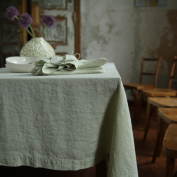 Pressed linen tablecloth and napkins on a dining table