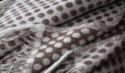 Soft woven wool throws in natural neutral colours