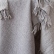 Close-up of the fringed edge on the grey Marcus throw